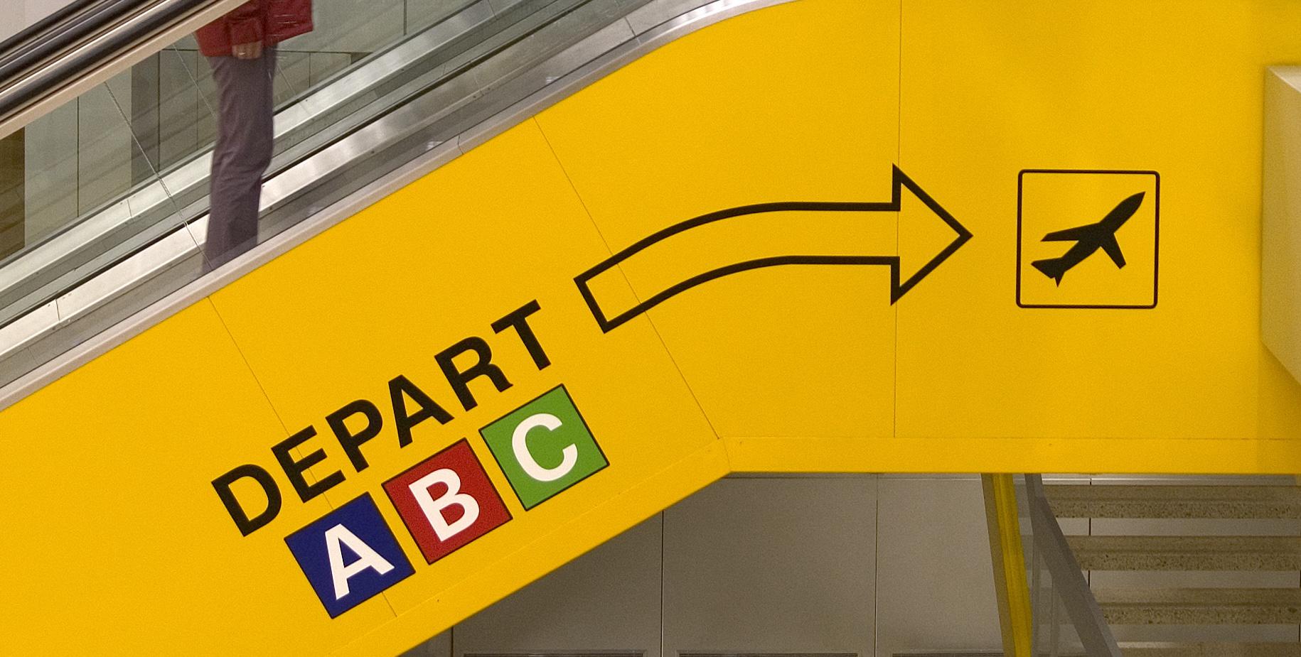 wayfinding signage on an escalator