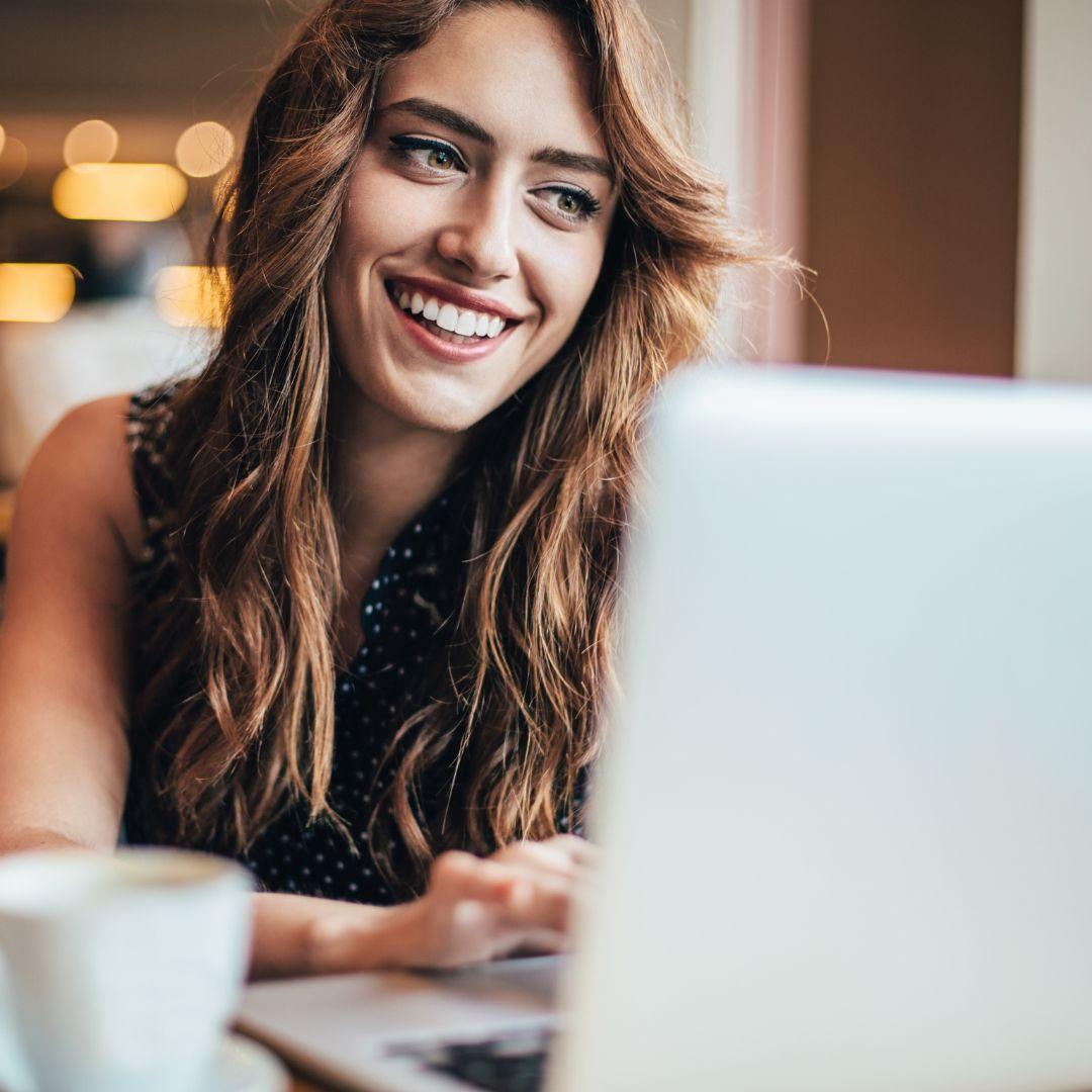 woman looking at her laptop