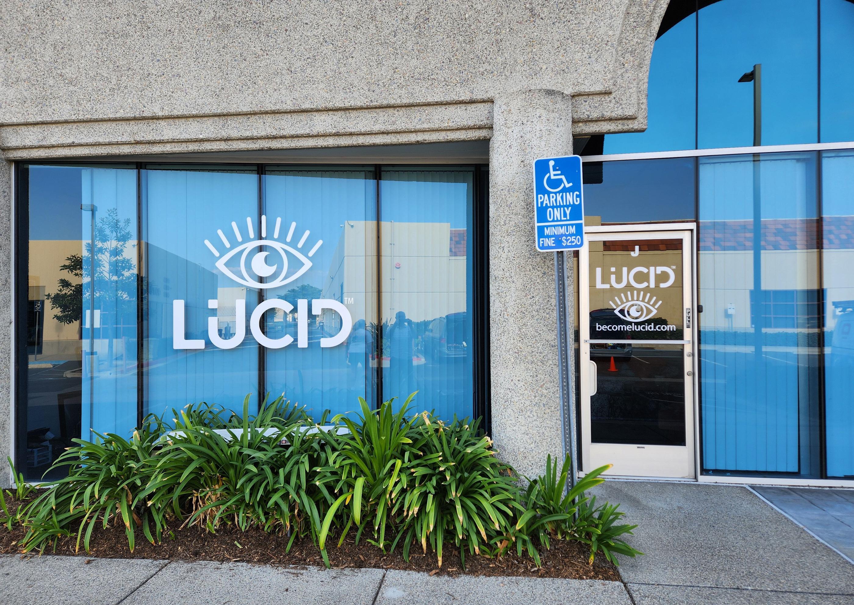 Window graphics with white cut vinyl on entrance door and large side windows