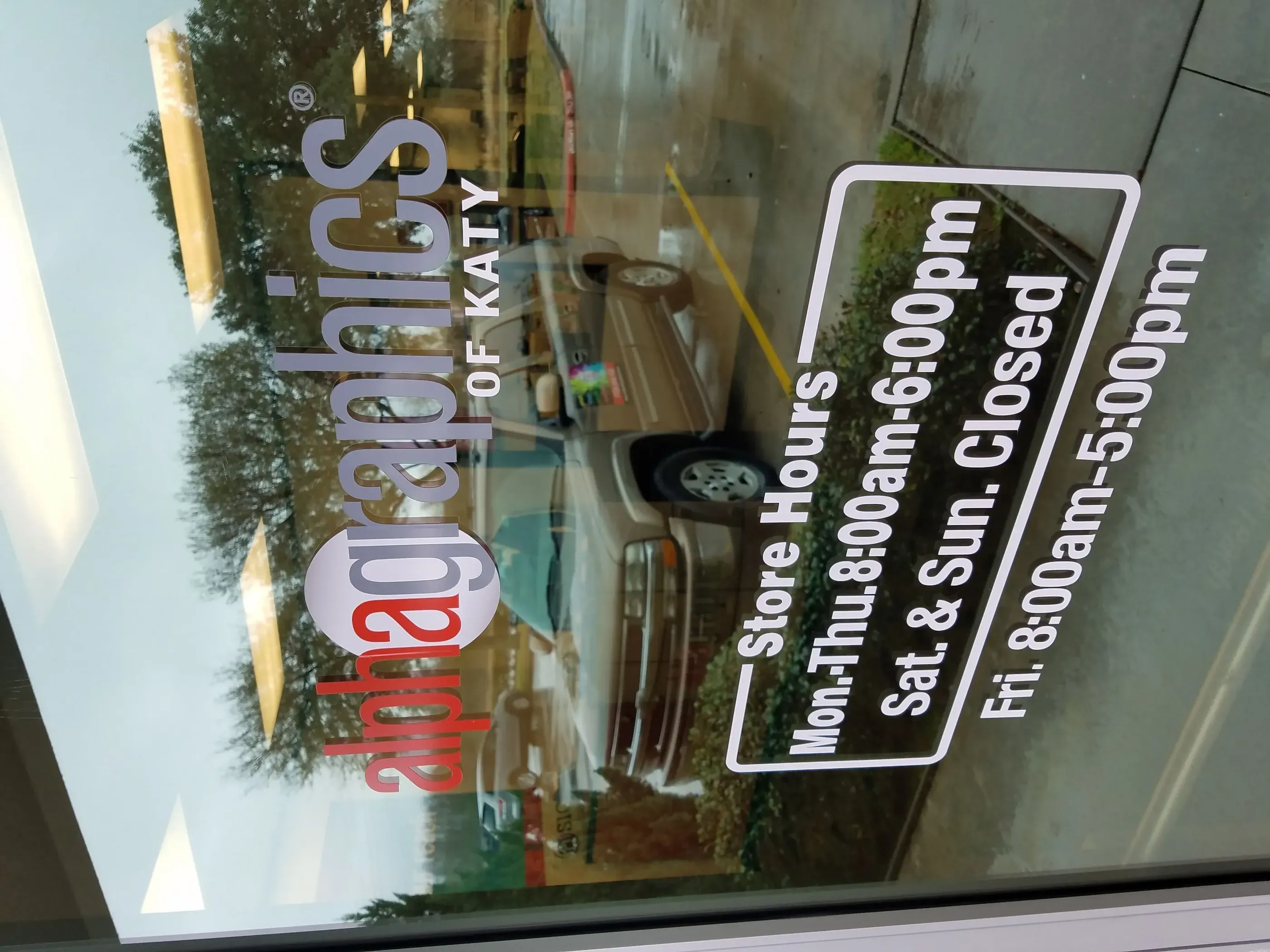 Window vinyl lettering with store hours